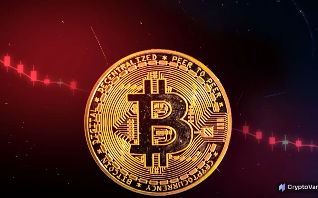 Bitcoin price below $80,000 illustration: a gold coin with a generic bitcoin symbol under red light, with falling red candlesticks behind it