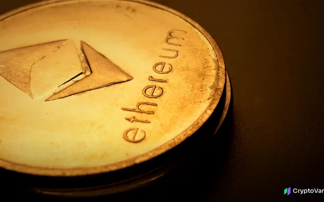 Close-up of a gold coin stamped with the ethereum logo in warm, dramatic light