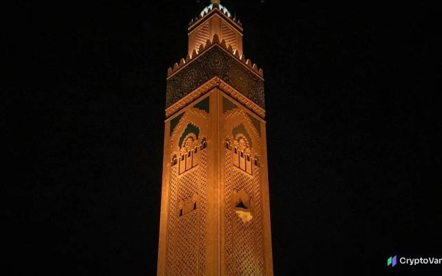 The illuminated minaret of the Hassan II Mosque in Casablanca at night